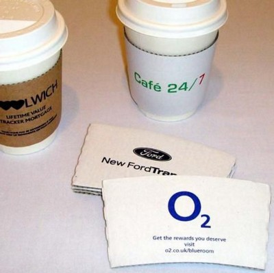 Our custom printed coffee sleeves are a superb way of getting your message across and to promote your brand and with a larger print area than paper cups, our clutches are the ideal solution for branding plain unprinted paper cups. Our coffee cup sleeves are manufactured from 100% recycled fibre/cardboard Available in two sizes to fit 8-10oz cups and 12-20oz cups in your choice of white or brown They can be printed in 1, 2 or 3 spot Pantone colours There is no minimum order for printing spot colours and are available printed in just 48 hours Our coffee clutches are also available in a 320 micron clutch with all over print coverage for 1 to 101 colours. Printing is available in full colour on the whole outside surface of the sleeve No Minimum Quantity Fast Turnaround Manufactured from 100% recycled cardboard Two sizes available Multi-Colour Prints (subject to artwork) Manufactured in the UK In-House Printing Environment friendly and 100% biodegradable Great for branding plain cups